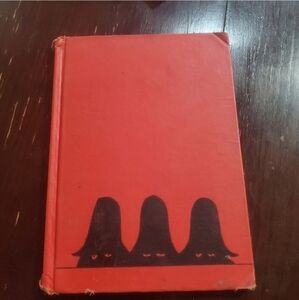 The three robbers by tomi ungerer. hard cover book. 2009 used condition. this bo